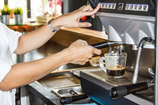 Women with coffee machine in shop Thailand