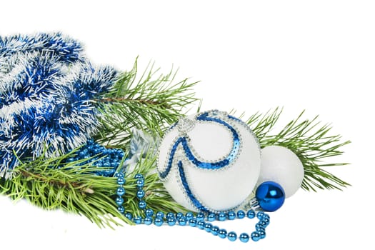 Christmas tree branch and blue ball with white glitter isolated