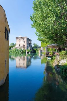 medieval building upon the Mincio river in Borghetto, Verona, Italy