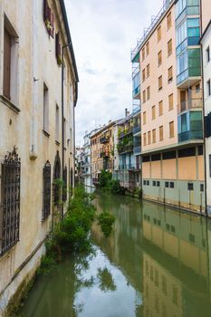 canal San Massimo runs among residential houses in the centre of the old city Padua
