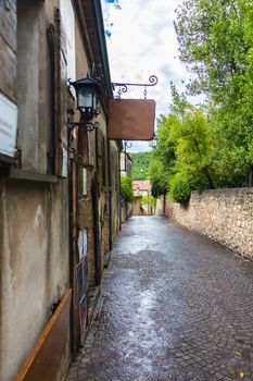 old narrow street of sidewalk pavers in Italy