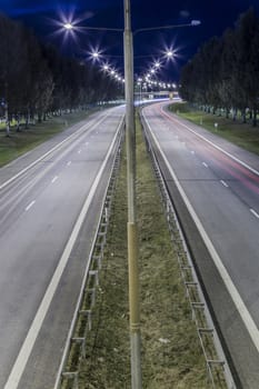 Highway Road with Trees and light trails.