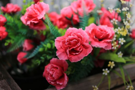 Red Artificial Rose flower in basket