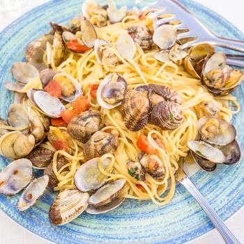 Restaurant in Naples, Italy. No photography set for this just arrived on the table Spaghetti alle vongole