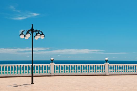 beautiful promenade with lanterns and white railings