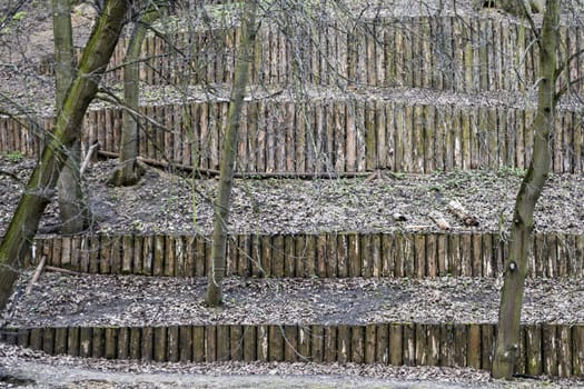 The dam of logs in the park. Architecture of logs in the park.