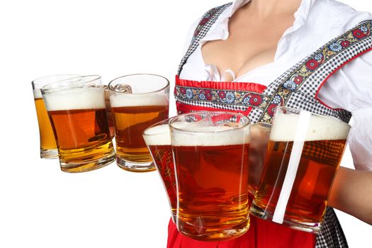 Young sexy woman wearing a dirndl with beer mugs over white, Oktoberfest concept