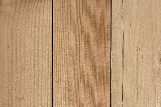 Three close lying pine boards. The texture of natural wood. Wooden background for posters, banners, web design. Close up image