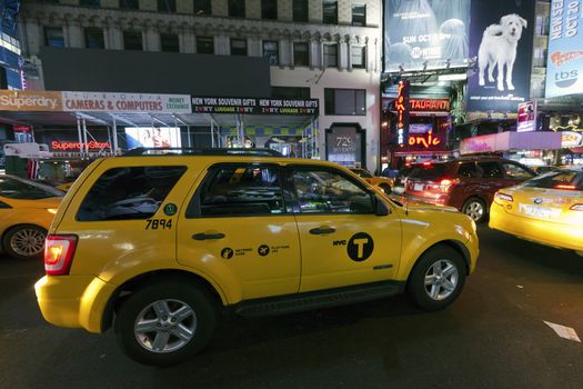 NEW YORK CITY, USA-OCTOBER 4:Times Square, featured with Broadway Theaters, Sightseeing Buses, Taxi Cabs and animated LED signs, is a symbol of New York City and the United States. Taken in Manhattan, New York City on October 4, 2014