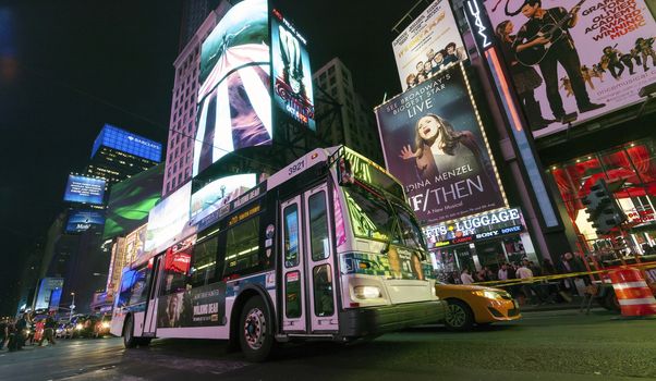 NEW YORK CITY, USA-OCTOBER 4:Times Square, featured with Broadway Theaters, Sightseeing Buses, Taxi Cabs and animated LED signs, is a symbol of New York City and the United States. Taken in Manhattan, New York City on October 4, 2014