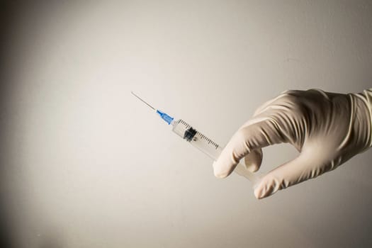 A person holding a syringe