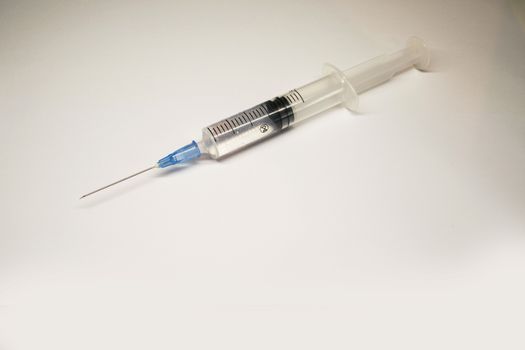 An isolated syringe in a white background