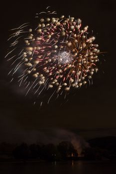 Beautiful night view and fireworks on the river in Moscow