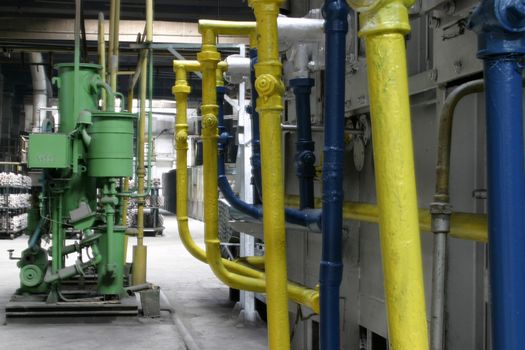 Factory scene with machinery and pipes.