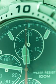 Macro detail of a swiss made watch, showing seconds timer in motion; time passing by.