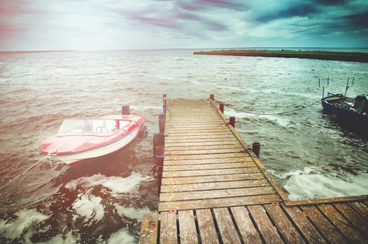 An image of boat moored in the harbor