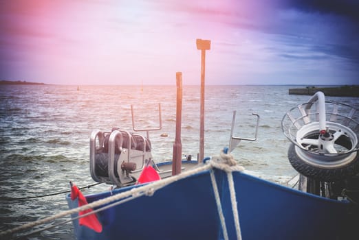 An image of boat moored in the harbor