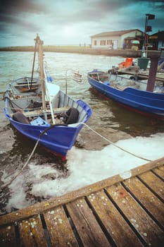 An image of boat moored in the harbor