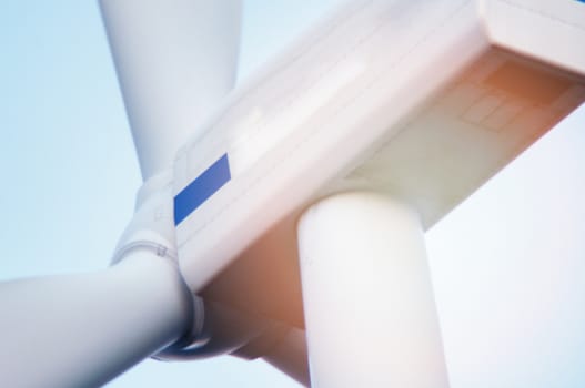 Wind turbine against deep blue sky -