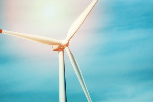 Wind turbine against deep blue sky -