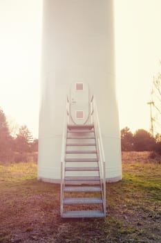 Wind turbine against deep blue sky -