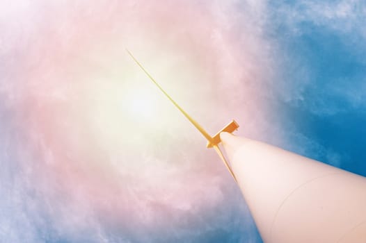 Wind turbine against deep blue sky -