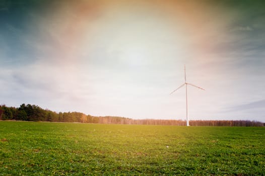 Wind turbine against deep blue sky -