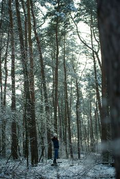 An image of young woman on a walk in snowy winter