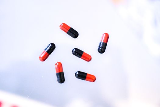 Medicine pills or capsules in hand, palm or fingers. Drug prescription for treatment medication..Antibiotic, painkiller closeup.