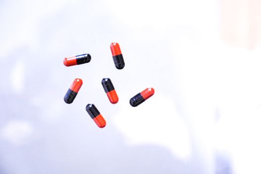 Medicine pills or capsules in hand, palm or fingers. Drug prescription for treatment medication..Antibiotic, painkiller closeup.
