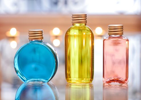 Perfume bottles Perfume bottles Blue Red and Yellow on a table