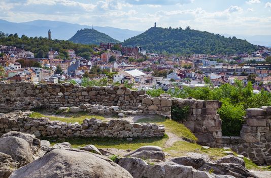 View of Plovdiv, Bulgaria downtown with ancient ruins in foreground.