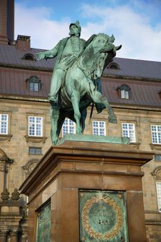 The equestrian statue of King Frederik VII in front of the Christiansborg Palace in Copenhagen, Denmark