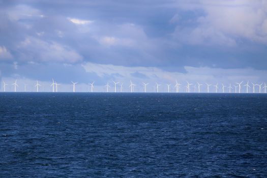 Windmills in a row in the Baltic sea