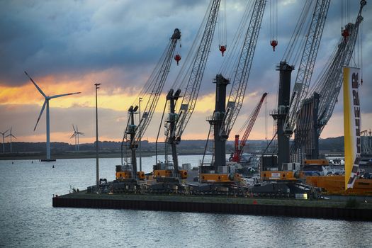 ROSTOCK, GERMANY - AUGUST 14, 2016: Container terminal and cranes in the port of Warnemunde. Rostock is largest Baltic port(photographed early in the morning)in Rostock, Germany on August 14, 2016.