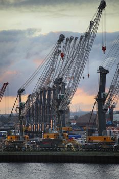 ROSTOCK, GERMANY - AUGUST 14, 2016: Container terminal and cranes in the port of Warnemunde. Rostock is largest Baltic port(photographed early in the morning)in Rostock, Germany on August 14, 2016.