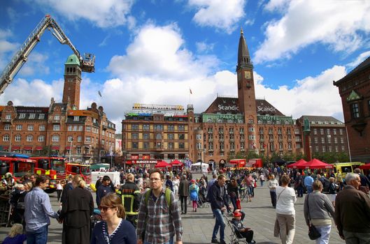 COPENHAGEN, DENMARK - AUGUST 14, 2016: Scandic Palace Hotel is a residential hotel on City Hall Square and many pedestrians, tourist in the City Hall square in Copenhagen, Denmark on August 14, 2016.