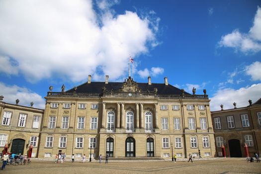 Copenhagen, Denmark – August  15, 2016: Amalienborg Square, with tourist, it's home of the Danish Royal family in Copenhagen, Denmark
