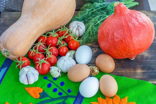 Bright Thanksgiving harvest composition of vegetables pumkin, calabash, tomatoes, garlic, eggs