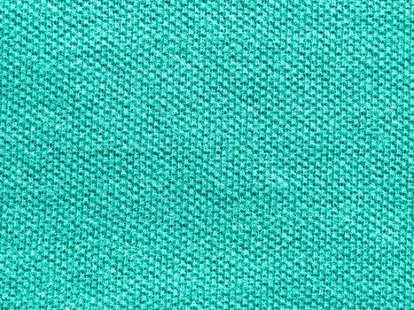 green knitted Jersey polo texture as textile background