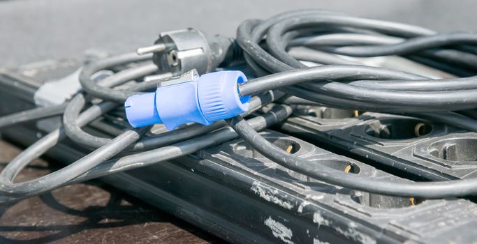 the blue electric plug on black cable