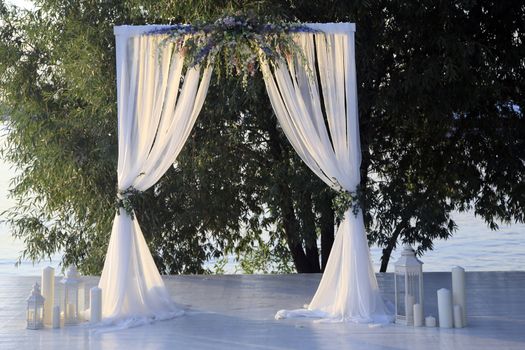 Beautiful wedding arch on the coast river