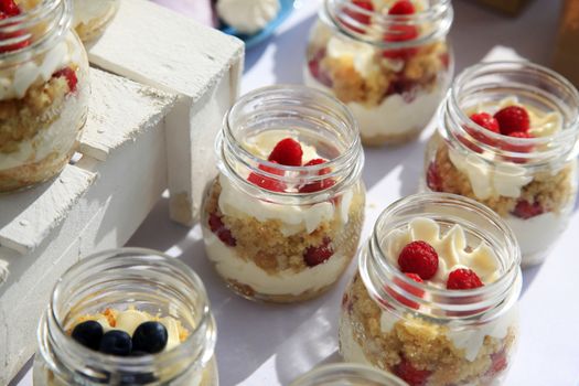 Dessert with fresh fruit in containers of glass