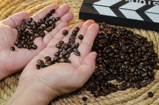 Coffee in hand  on a jute rope.