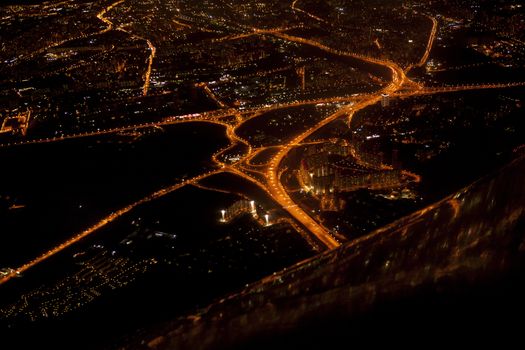 Night view of the city of Moscow from a flying airplane.