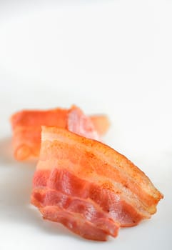 cooked slice of bacon isolated on white