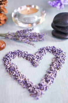 Candles with heart lavender flowers on table, France, Europe