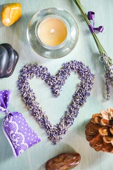 Candles with heart lavender flowers on table, France, Europe