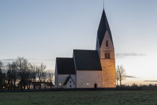 Church in Tofta, Gotland in Sweden with the pathway leading up the the church.