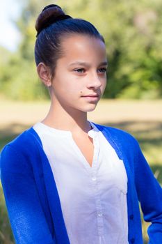 portrait of teen girl outdoors in the park